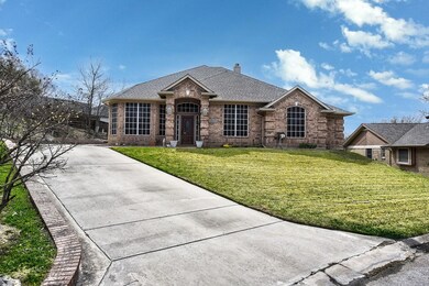 View of front of property featuring driveway, a fr