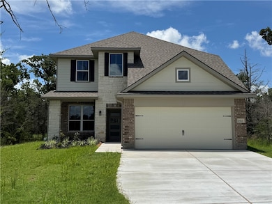 View of front of house featuring roof with shingle