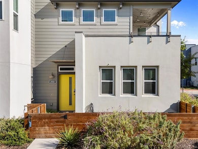 Doorway to property featuring stucco siding