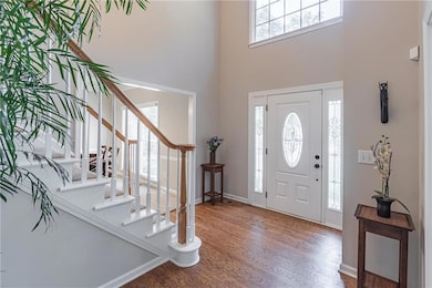 Spacious bright 2 story foyer. This is one of two sets of stairs that lead to the second floor.
