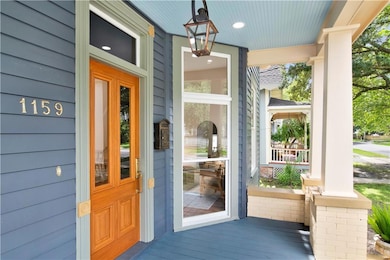 Doorway to property featuring a porch