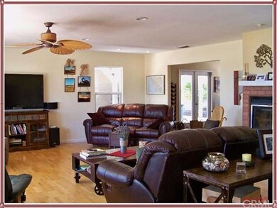 ANOTHER VIEW OF LIVING ROOM WITH FIREPLACE AND LOO