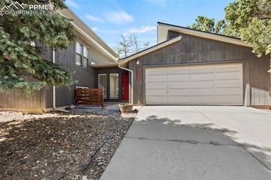 View of front of home featuring a garage