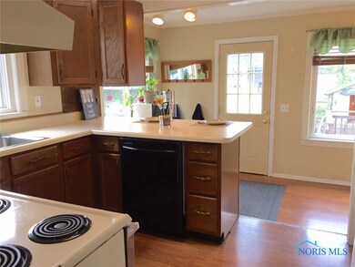 Kitchen door leads to deck, almost 1/2 acre fenced