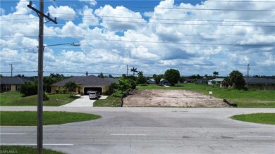 View of asphalt road with street lights and a residential view