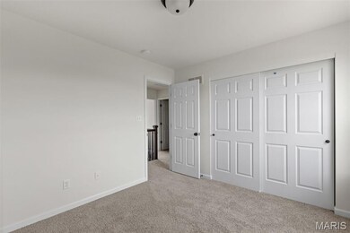 Unfurnished bedroom featuring carpet and a closet