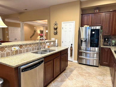 Kitchen w/stainless app., granite counters & pantry