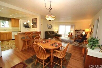 Living room has dual pane sliding glass doors lead