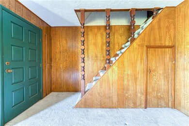 Entry, Stairs lead to finished attic/4th bedroom.