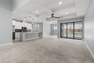 Unfurnished living room featuring beam ceiling, co