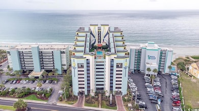 Aerial view of expansive beach and apartment complex