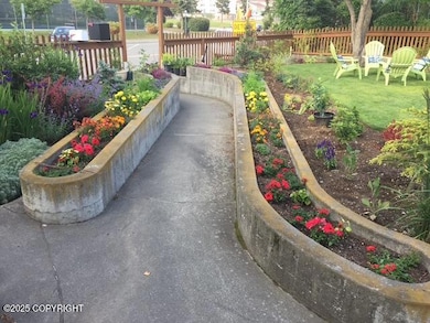 Raised Flower Beds Line the Walkway