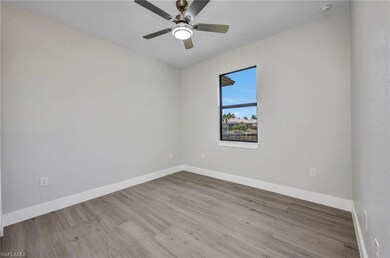 Spare room with wood finished floors, a ceiling fa