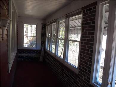 Enclosed front porch makes great Sun Room!