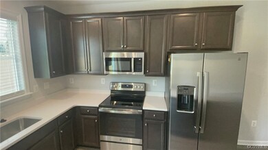 Kitchen with sink, appliances with stainless steel