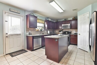 Spacious eat in kitchen area, island, and tons of