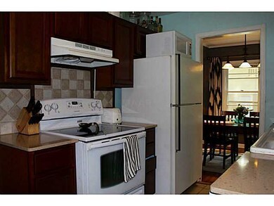 Backsplash, cabinets, and counter tops are neutral