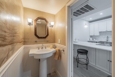 Bathroom featuring a wainscoted wall, visible vent
