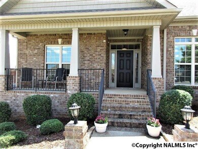 Covered Front Porch w/Decorative Landscaping