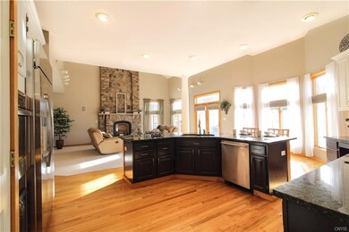 Kitchen adjoins two story family room with new dis