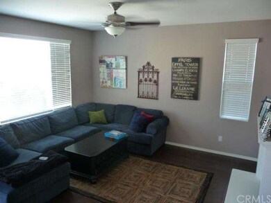 Another view of the family room with ceiling fan.