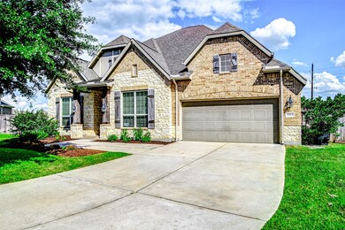 This home features a mix of brick and stone exteri