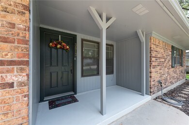 Property entrance with covered porch
