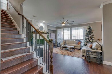 VIEW OF LIVING AREA & STAIRS TO MEDIA RM