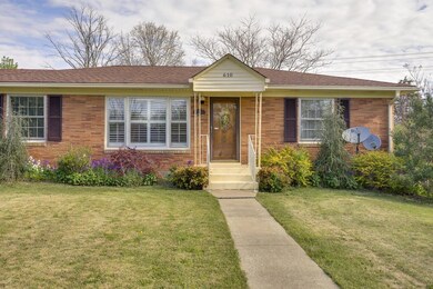 SMALL COVERED FRONT PORCH WITH FRONT DOOR THAT OPENS INTO THE LIVING ROOM