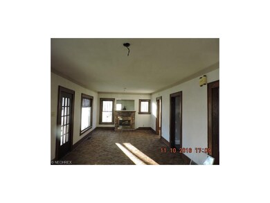 The huge fireplaced living room has classic window