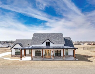 Modern farmhouse featuring covered porch