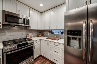 Kitchen with appliances with stainless steel finis