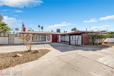 View of front of house featuring concrete driveway