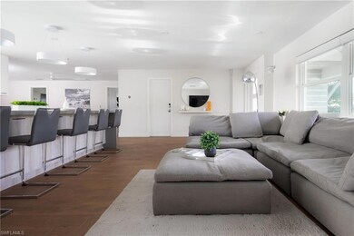 Living room featuring dark wood-type flooring