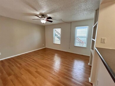 Empty room featuring wood finished floors, a ceil