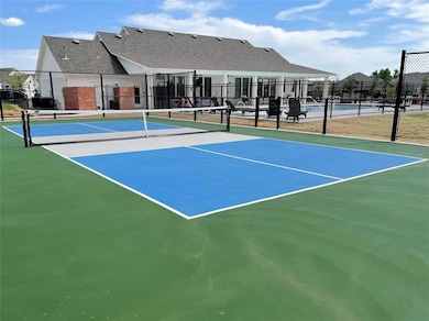 View of tennis court featuring community basketball court