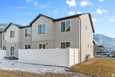 Rear view of property with a mountain view