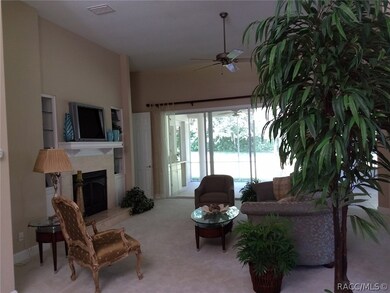 Living room with 4 sliders to screened lanai with