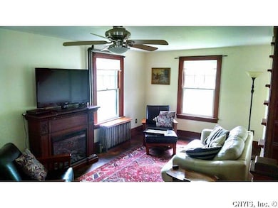 Living Room. Beautiful untouched woodwork around w