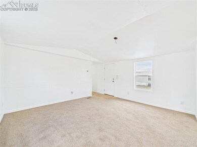 Unfurnished room with carpet floors, baseboards, a