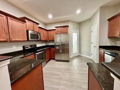 The kitchen offers lots of cabinet space and pantry. The granite countertops plus stainless steel appliances