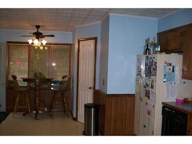 Kitchen. Eat-in area of kitchen.  Half bath behind