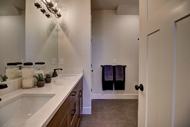 Bathroom featuring vanity and tile patterned flooring