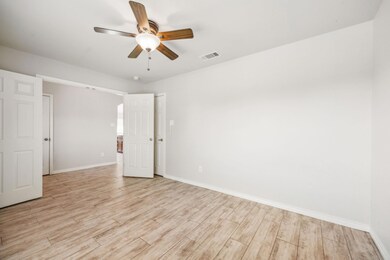 Unfurnished room featuring ceiling fan and light h