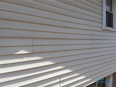 NEWER VINYL SIDING.