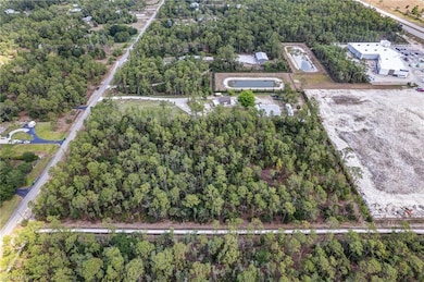 View of property location with a forest