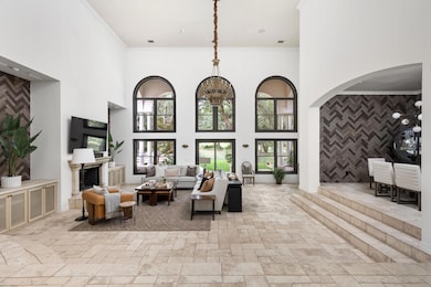 Living area with a towering ceiling, ornamental m