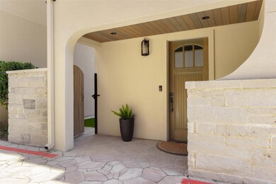 Property entrance featuring stucco siding