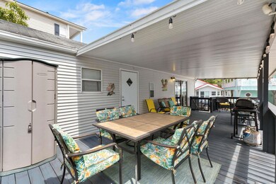 Wooden terrace featuring outdoor dining area