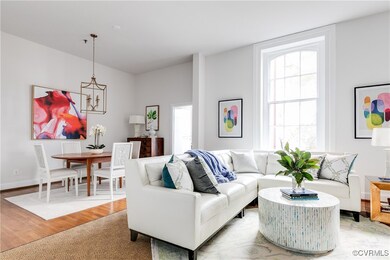 Living room featuring wood-type flooring and a cha
